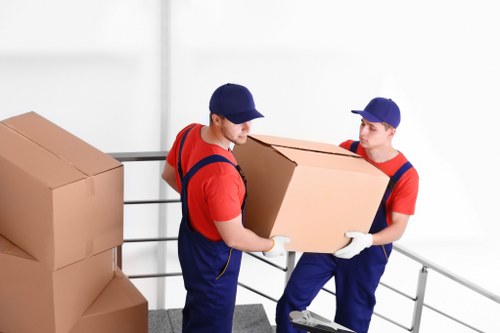 Business removal van loading office furniture in a Dulwich street