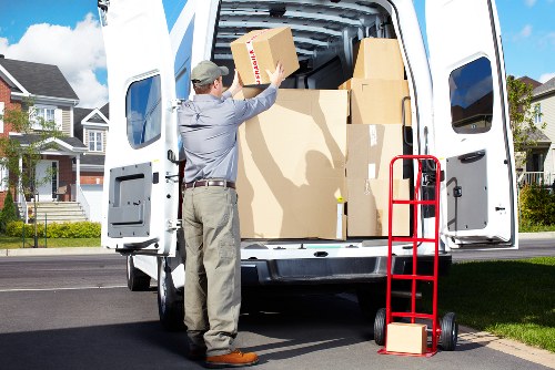 Professional movers carrying household items during an urgent Dulwich relocation