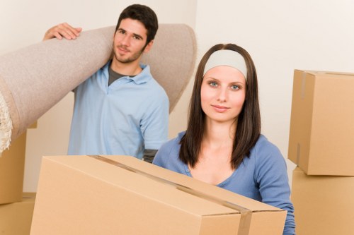Office desks and chairs being arranged in a new workplace