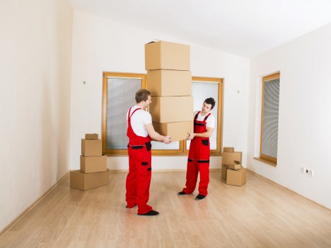 Careful loading of a sofa and table for local furniture removals
